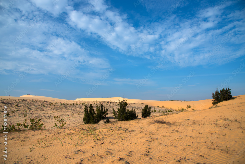 White sand dune on blue sky background at Mui-Ne city, Vietnam White sand dune on blue sky background at Mui-Ne city, Vietnam