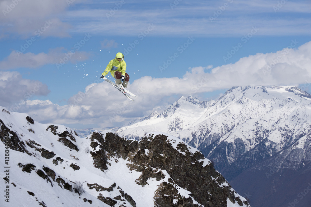 Skier jump on mountains. Extreme sport.