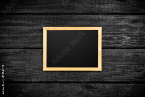 Picture frame on a wooden wall