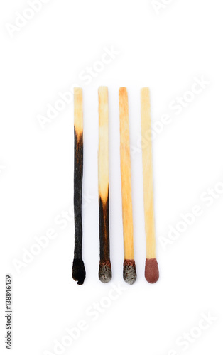 Laid used matchsticks isolated on white background