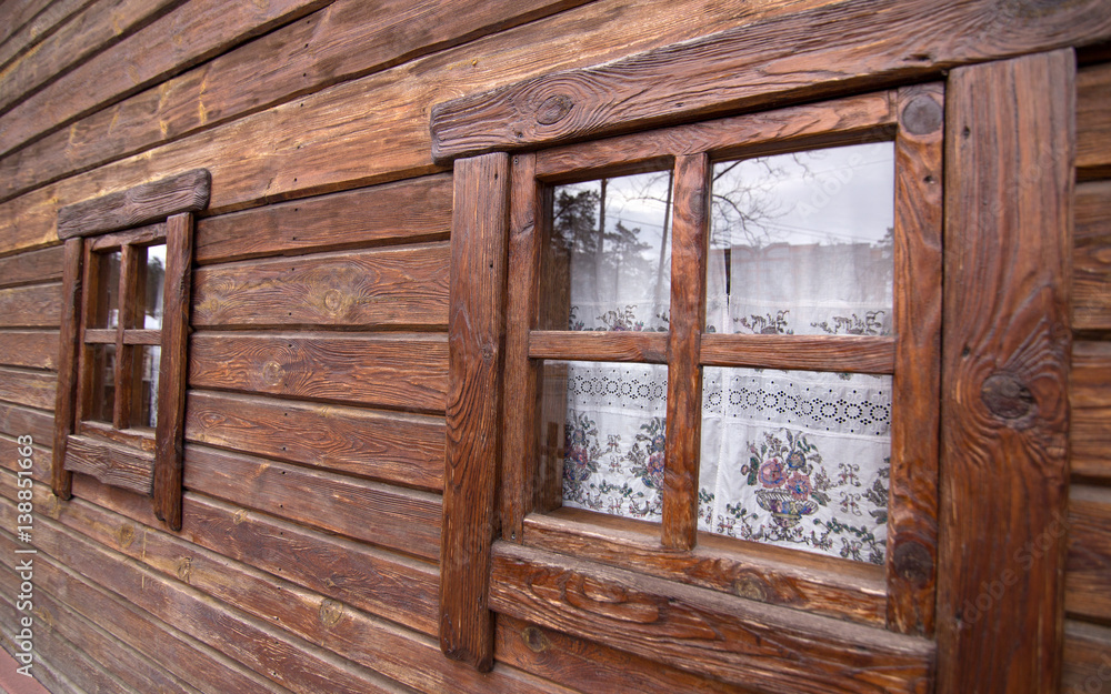 Old wooden windows frame on stone wall and view of sky Old wooden windows frame on stone wall and view of sky