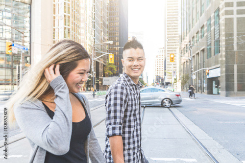 Photography Asian couple walking togheter in the city