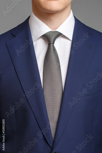 man in blue tuxedo with grey tie