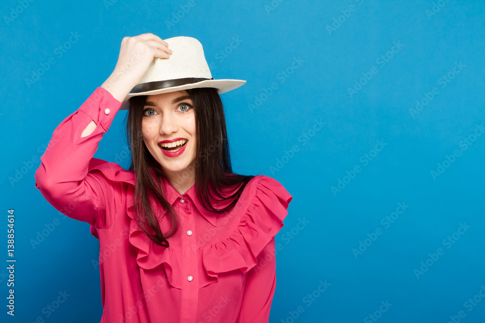 Beautiful woman in hat. Retro fashion. Blue Background. Beautiful woman in hat. Retro fashion. Blue Background.