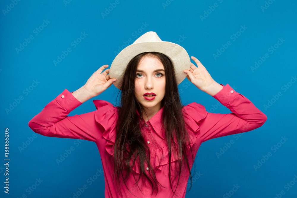 Beautiful woman in hat. Retro fashion. Blue Background. Beautiful woman in hat. Retro fashion. Blue Background.