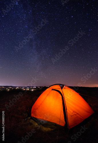 Tourist tent at the night under the starry sky