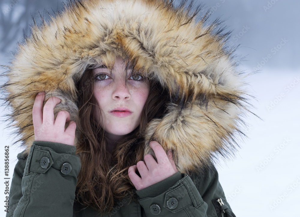 Sheltered teenager on a snowy day in the province of Alicante, Spain. Horizontal shot Sheltered teenager on a snowy day in the province of Alicante, Spain. Horizontal shot