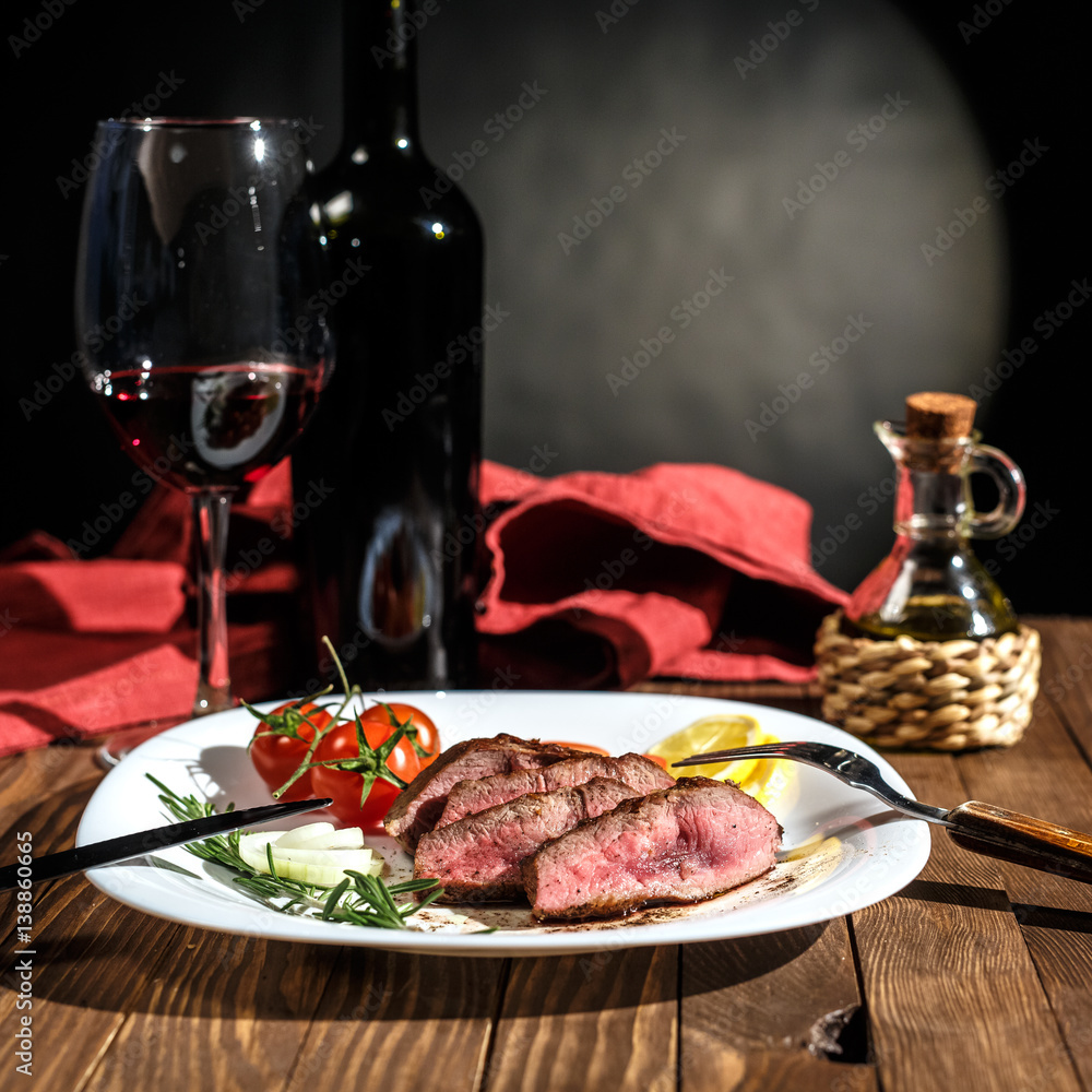 Beef steak with red wine of a rich dining table Stock Photo | Adobe Stock
