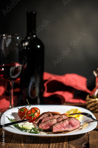 Beef steak with red wine of a rich dining table