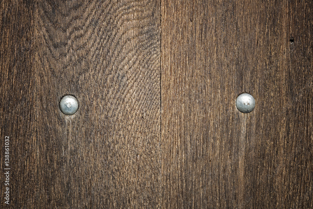 Wooden board with rivets