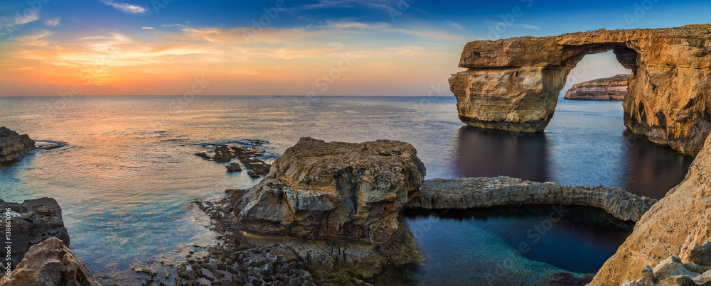 Gozo, Malta - Panoramic view of the beautiful Azure Window, a natural arch and famous landmark on the island of Gozo at sunset