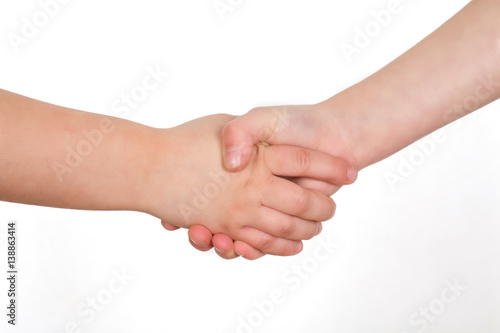 School kids shaking hands. Handshake isolated on a white background. 