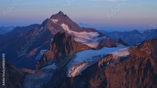 Sunset scene in the Swiss Alps, purple mountains Fleckistock and Stucklistock.