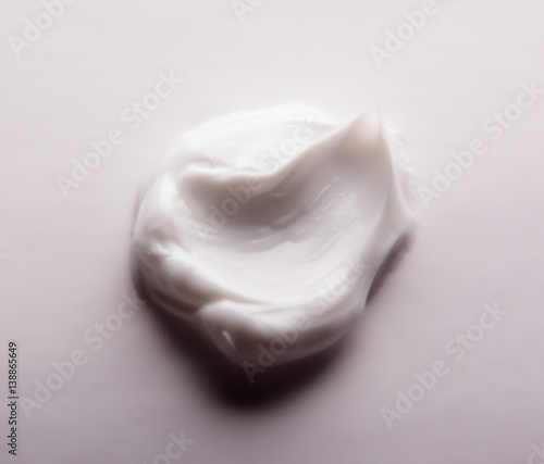 Smear cream isolated on white background. Cream texture.