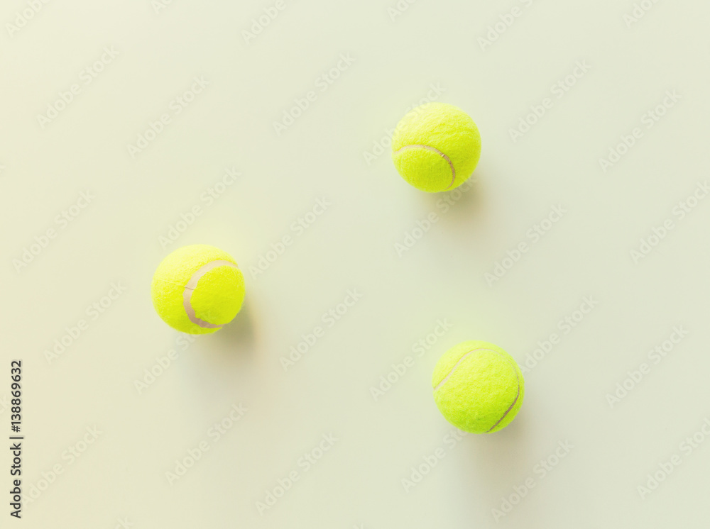 close up of three yellow tennis balls