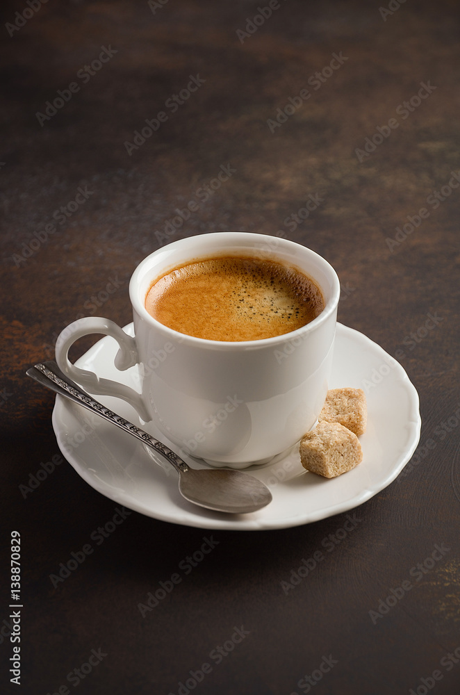 Cup of fresh coffee with coffee beans on dark background, selective focus, copy space Cup of fresh coffee with coffee beans on dark background, selective focus, copy space