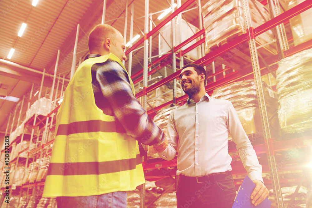 worker and businessmen with clipboard at warehouse worker and businessmen with clipboard at warehouse
