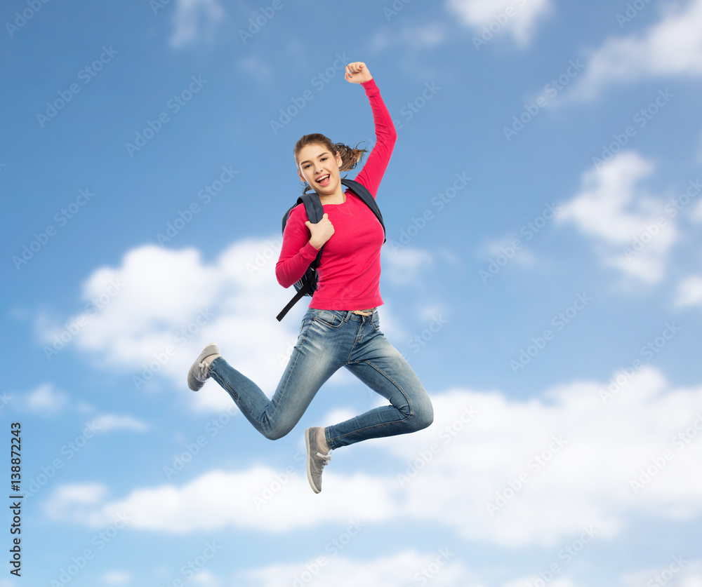 happy woman or student with backpack jumping happy woman or student with backpack jumping