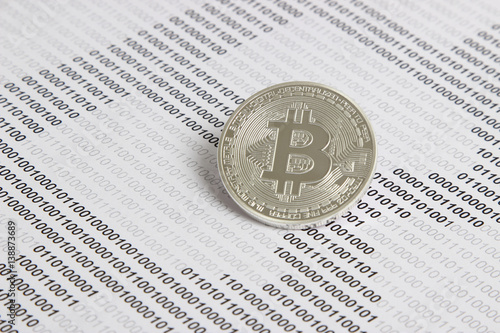 bitcoin on the background of binary code