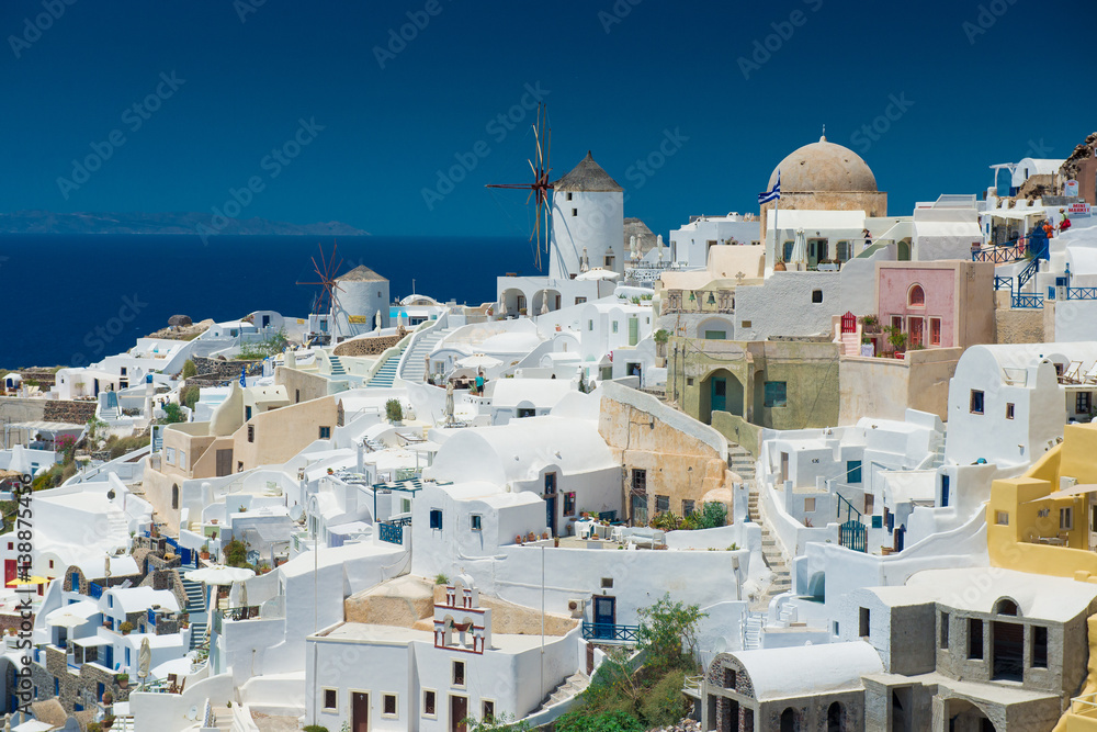 Architecture of  island of Santorini, the most romantic island in the world, Greece. Hotels in Santorini. Walking the streets of Fira summer day, Travel to Greece. Beautiful white exterior Santorini
