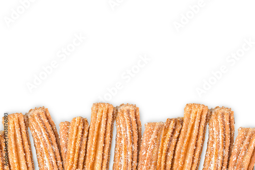 Churros arranged in row isolated on white background