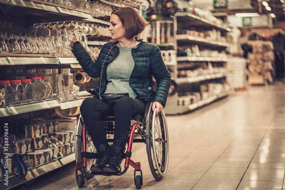 Disabled woman in a wheelchair in a department store