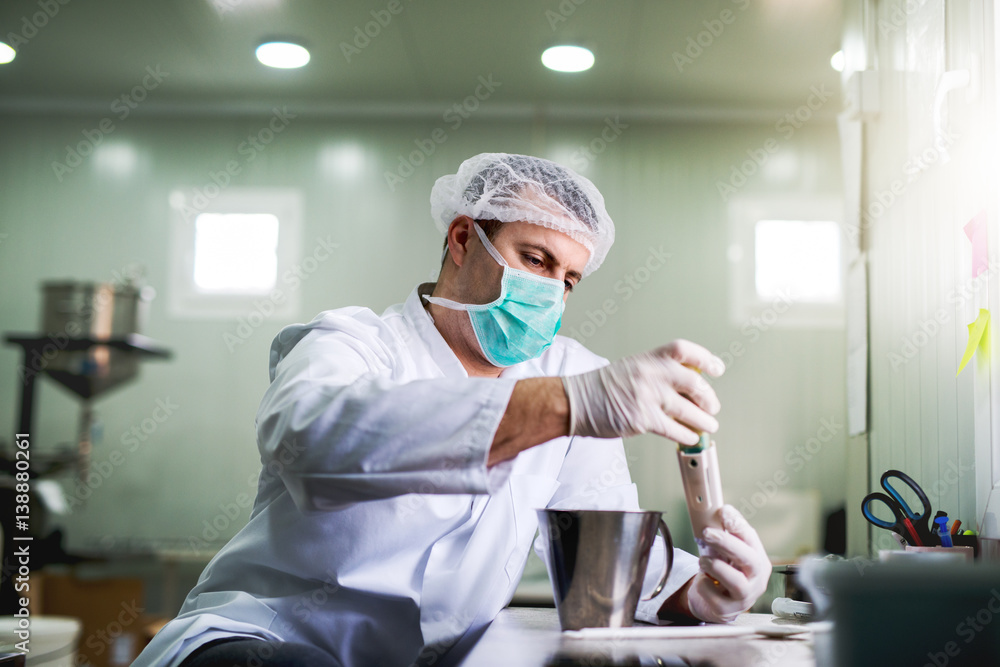 Protective worker at pharmaceutical factory on his work place. Protective worker at pharmaceutical factory on his work place.