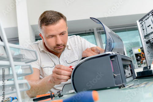 Man working on printer