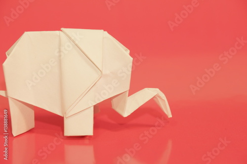  Paper origami elephant isolated on a colorful background