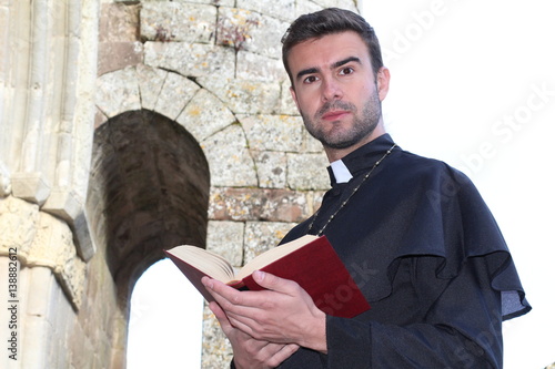 Картината върху платно Handsome young priest close up with copy space