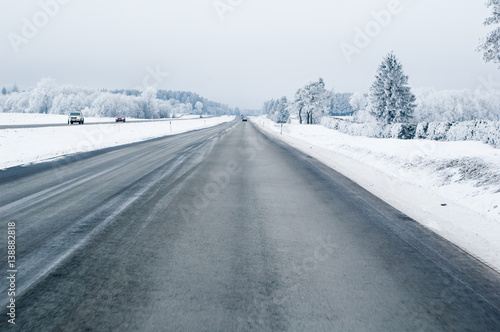 Highway in the winter, the trees covered with hoarfrost