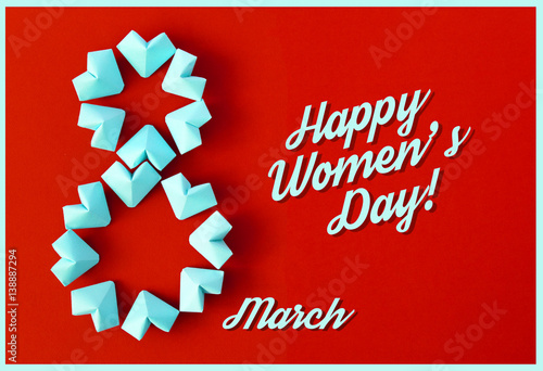 Happy International Women’s Day celebrate on March 8 CARD. rose-color paper hearts shape figure eight 8 on color background 