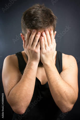 Worried man with hands on face © creativefamily