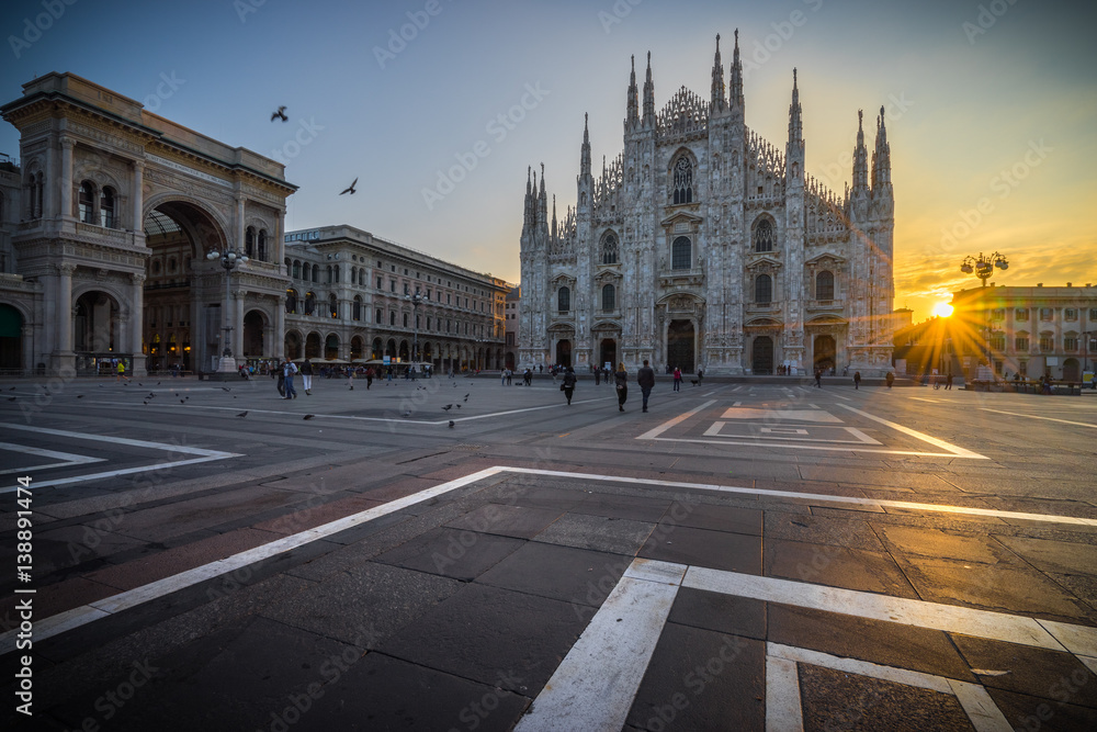 Duomo cathedral with beautiful sunrise flare, Milan. Italy 