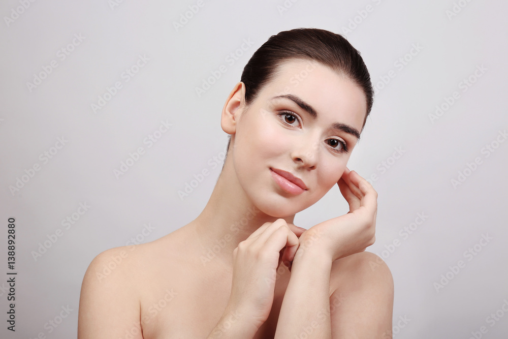 Beautiful young woman on light background Beautiful young woman on light background