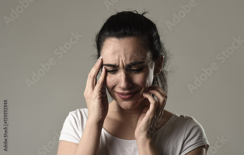 beautiful and sad woman crying desperate and depressed with tears on her eyes suffering pain