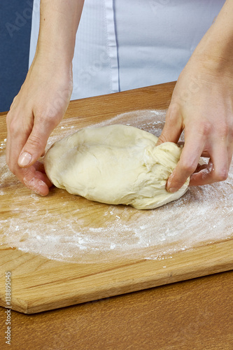 Woman rolls squeezes dough Handmade Series Food recipes