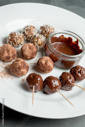 Energy Balls and Chocolate Dip on White Plate