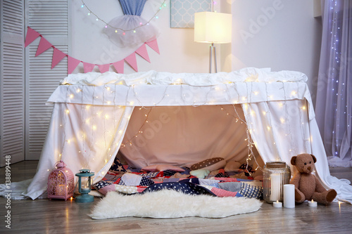 Hovel decorated with garland for children's party at home © Africa Studio