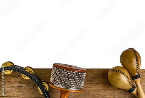 Flat lay of Latin percussion on wood desk