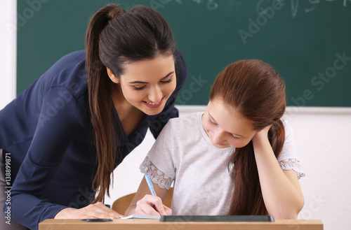 Female teacher and schoolbo...