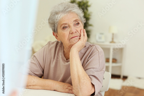 Photography Depressed elderly woman at home