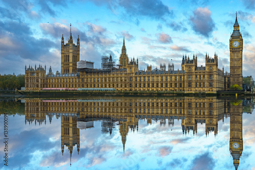 Big Ben and Westminster Bridge with colorful sky and reflection, London, UK
