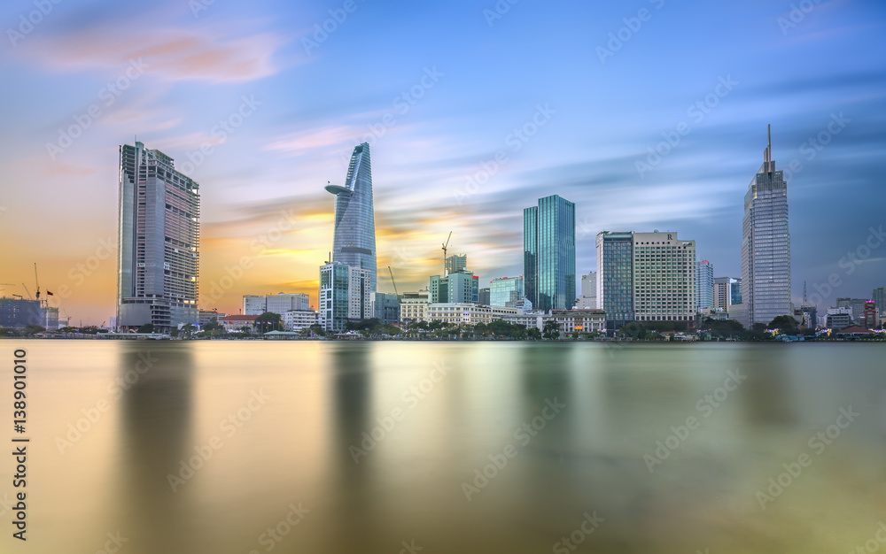 Ho Chi Minh City, Vietnam - February 14th, 2017: Beauty skyscrapers along river light smooth down urban development in Ho Chi Minh City, Vietnam