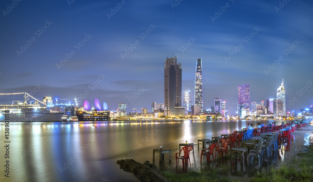 Ho Chi Minh City, Vietnam - February 14th, 2017: Beauty skyscrapers along river light smooth down urban development in Ho Chi Minh City, Vietnam Ho Chi Minh City, Vietnam - February 14th, 2017: Beauty skyscrapers along river light smooth down urban development in Ho Chi Minh City, Vietnam