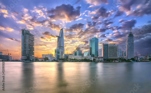Ho Chi Minh City, Vietnam - February 14th, 2017: Beauty skyscrapers along river light smooth down urban development in Ho Chi Minh City, Vietnam © huythoai