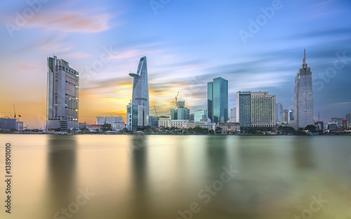 Fototapeta Naklejka Na Ścianę i Meble -  Ho Chi Minh City, Vietnam - February 14th, 2017: Beauty skyscrapers along river light smooth down urban development in Ho Chi Minh City, Vietnam