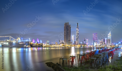 Wallpaper Mural Ho Chi Minh City, Vietnam - February 14th, 2017: Beauty skyscrapers along river light smooth down urban development in Ho Chi Minh City, Vietnam Torontodigital.ca
