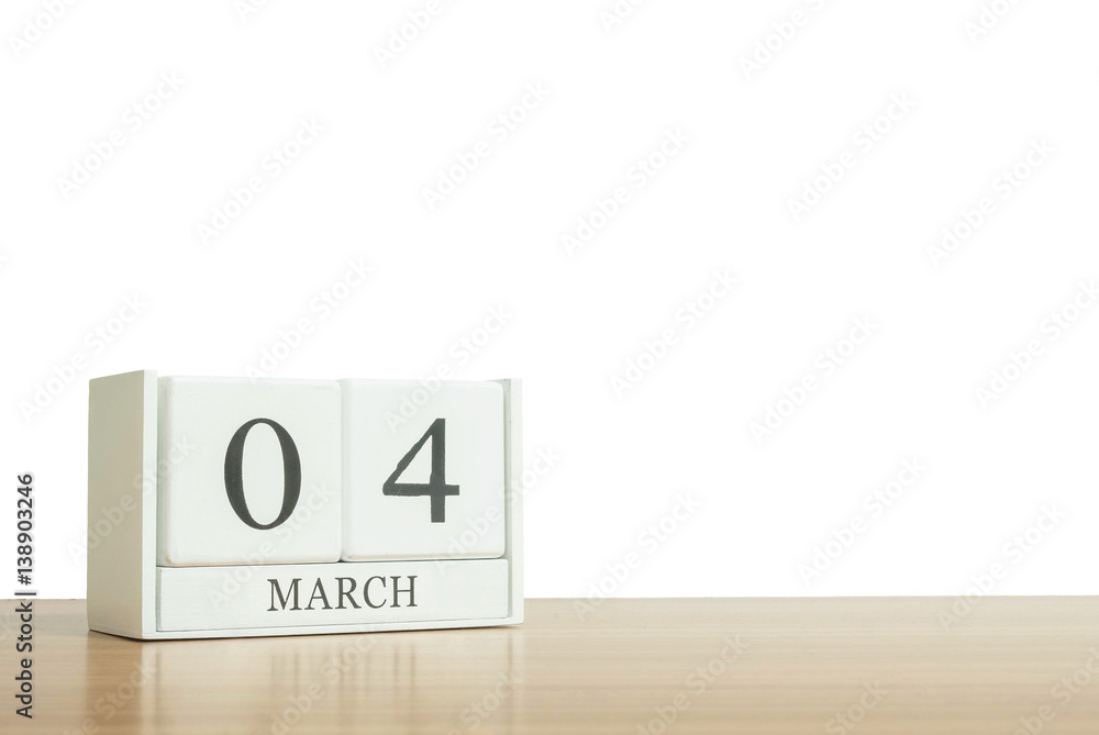 Closeup surface white wooden calendar with black 4 march word on blurred brown wood desk isolated on white background with copy space , selective focus at the calendar Closeup surface white wooden calendar with black 4 march word on blurred brown wood desk isolated on white background with copy space , selective focus at the calendar