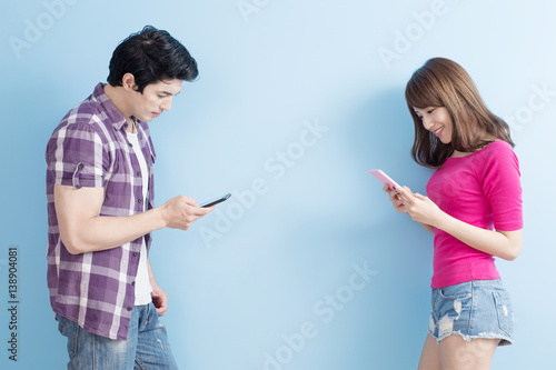 young couple use phone